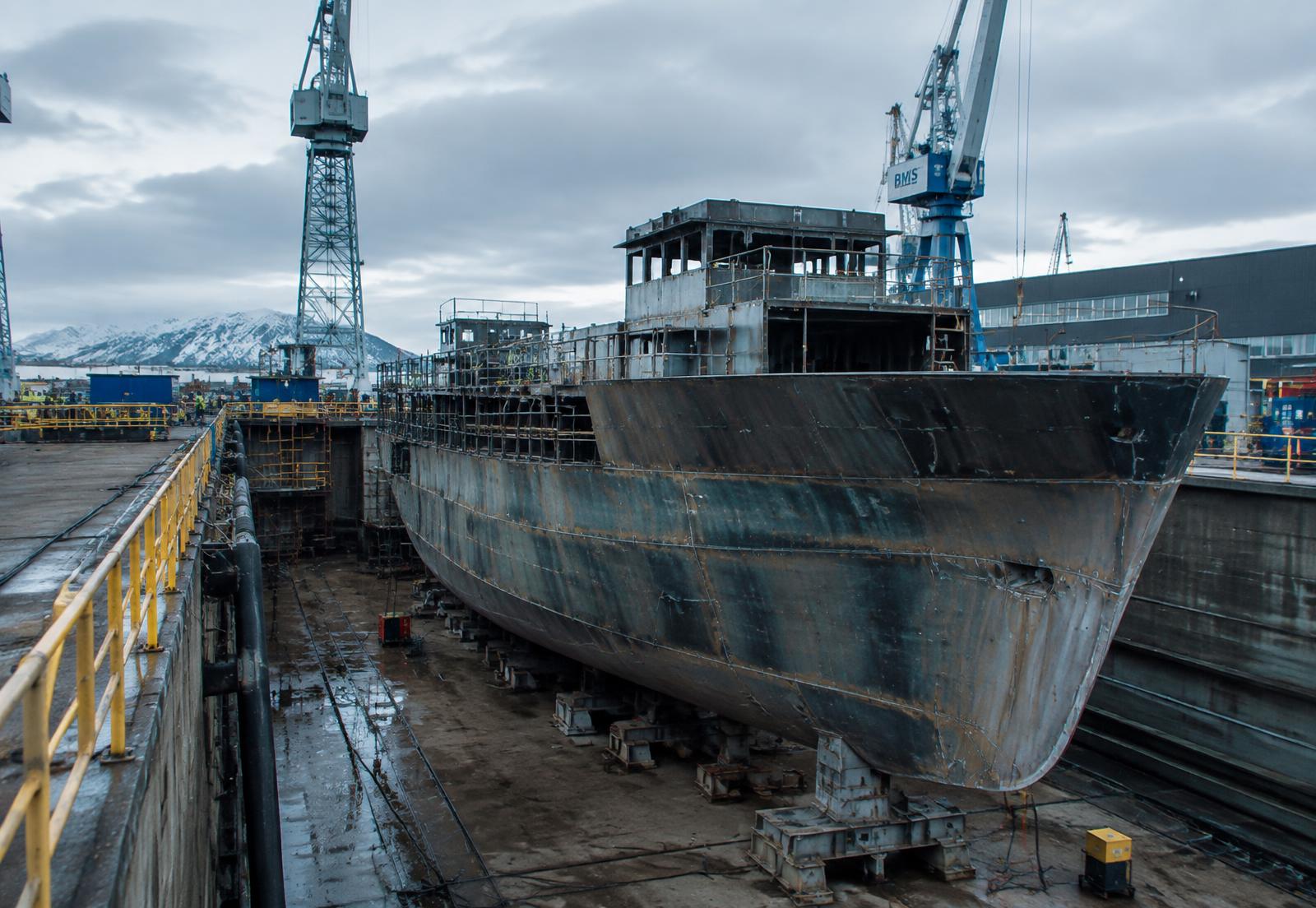 Vessel hull under construction in dry dock